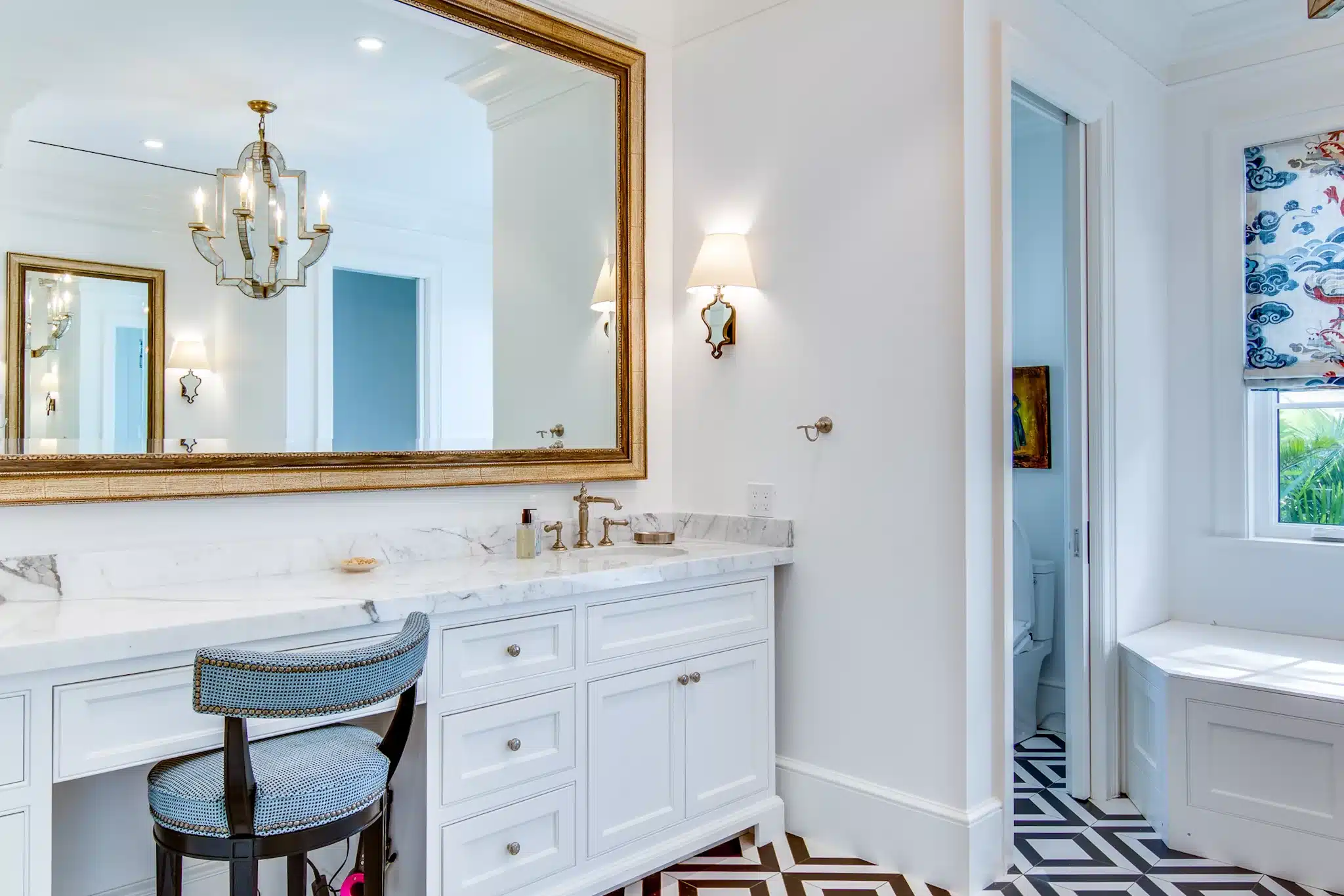 mirror with white cabinets near the bathroom