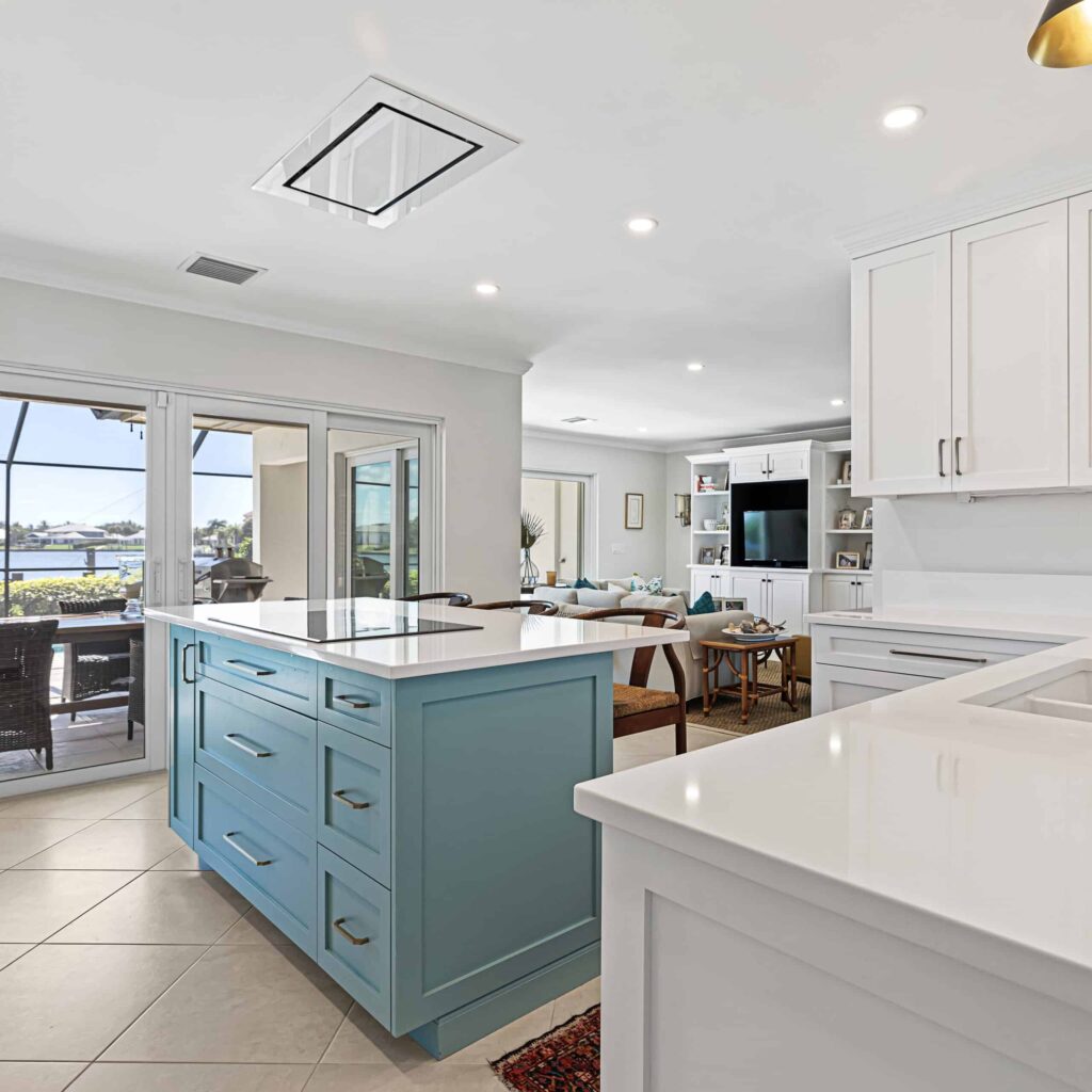 Coastal White Kitchen With Green Blue Island